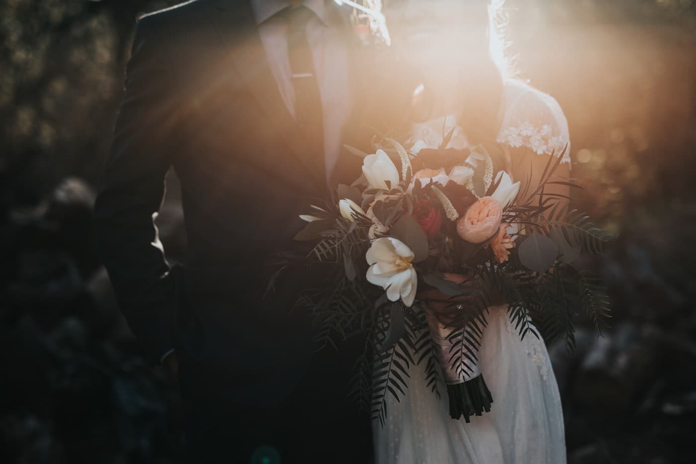 Wedding couple walking outside after a formal event